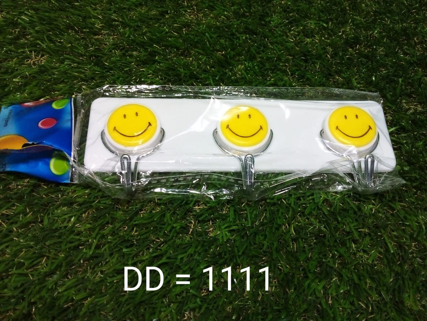 Bright and fun smiley face wall hooks for kidsβ rooms.