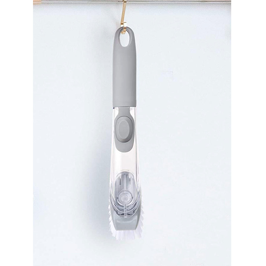 Liquid dispensing dish brush
